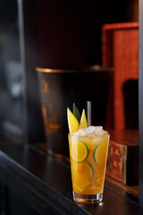 Yellow coctail with mango, lime and orange