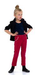 Stylish girl standing with hands on her waist