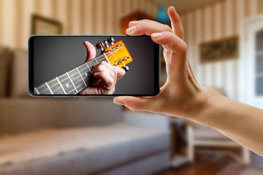 Online guitar lesson via smartphone.
