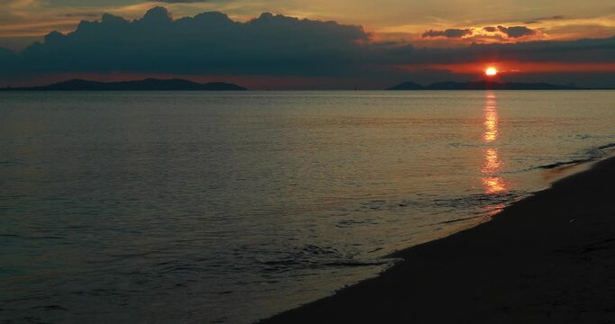 sunrise or sunset over the tropical summer beach and blue sky and sun rays.