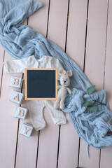 Mockup for announcement pregnancy . Space for text on textile background