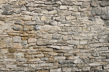 Ancient wall of castle. Old stone wall, grunge textured background. Photo