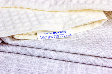 Pure natural light shades cotton fiber fabric with cloth label.