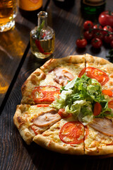 Tomatoe pizza on wooden table