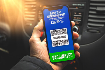 Vaccinated person goes to travel with health passport digital app on the screen of smartphone