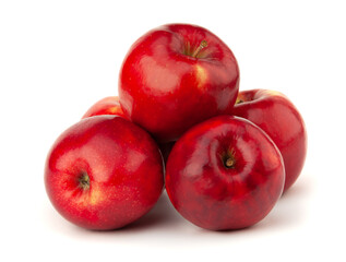 Several red apples lie on a white background