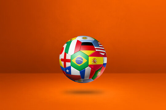 Football soccer ball with national flags on a orange studio background