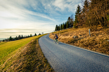 Women cycling on the mountain road

