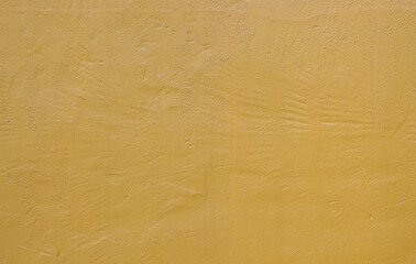 Yellow cement wall.