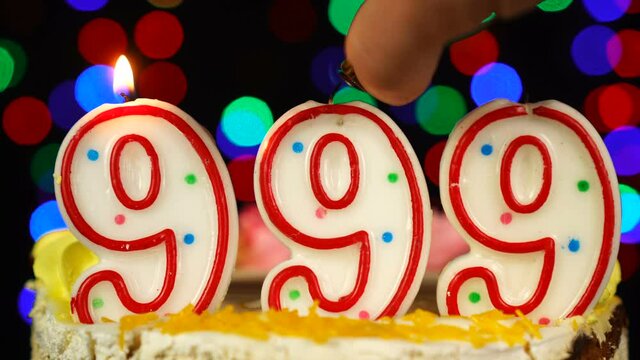 Number 999 Happy Birthday Cake With Burning Candles Topper.