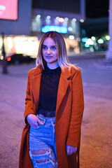 portrait of a woman in the city at night
