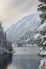 Mountain lake after snowfall. The Kulsai lake, Kazakhstan.