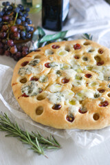 Aromatic Italian focaccia with grapes, gorgonzola cheese, Italian herbs and olive oil.