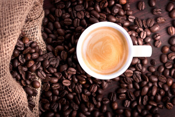 cup of coffee with beans sepia