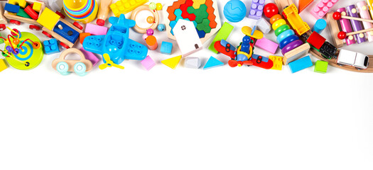 Baby kids toy banner background. Colorful educational toys on white background. Top view, flat lay, copy space for text