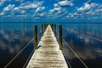 Naklejka premium Reflected Clouds Over Choctawatchee Bay Dock