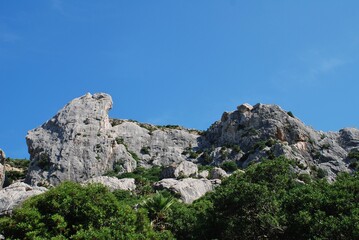 The rocky peaks of the Tramuntana mountains in the Boquer valley trail near Puerto Pollensa on the Spanish island of Majorca 