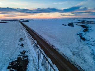 A beautiful view of the sun setting  over the prairie province of Saskatchewan in the winter