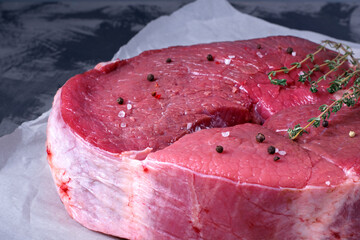 Raw veal meat on the parchment paper. Farm product