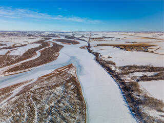Aerial view of the North Saskatchewan River in a rural area of the prairies during the winter