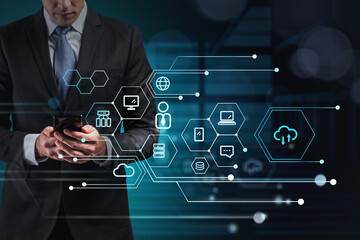 Businessman with phone, data symbols and network circuit