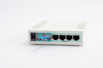 Wi-Fi router with cut cable. White router with dangling cord. On white background router with...