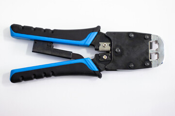 Twisted pair crimper. Device for crimping network cable. Tool for installing RG-45 on cord.