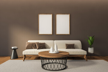 Frames and white couch in living room interior with coffee table and plant