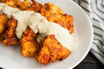 Chicken Fried Chicken and White Gravy: Breaded, fried chicken cutlets topped with white gravy