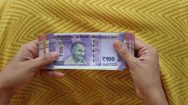 Counting Indian currency Rupee , hand giving Indian money 100, 200, 2000 rupees banknote Kerala India 4K slow motion video, footage. Business woman counting giving money cash new Indian currency notes