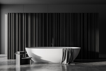 Fototapeta na wymiar Grey bathroom interior with bathtub on concrete floor
