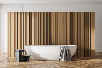 Front view of modern bathroom interior with bathtub and slatted partition