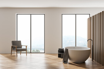 Wooden bathroom interior with armchair, bathtub on parquet floor and windows