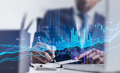 Man in office room, graph changes lines and bars with numbers