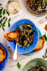 mussels in creamy sauce in a e frying pan.top view