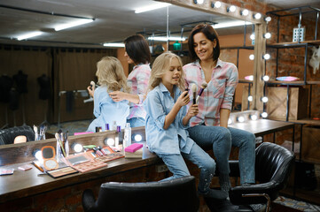 Mother and daughter leisures in makeup salon