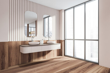 Fototapeta na wymiar Bathroom interior with two sinks and mirrors, windows with city view