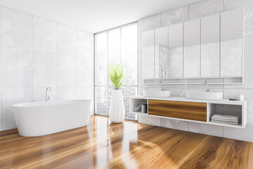 Bathroom interior. Minimalist bathtub on wooden floor with plant and sinks