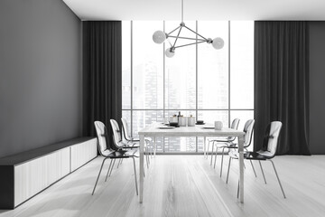Black and white dining room interior with furniture near window