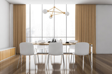 Beige wooden dining room interior with furniture near window