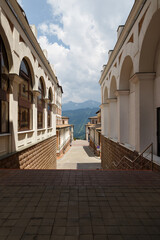 Fototapeta na wymiar Beautiful view of the mountains among the narrow streets of the city. Travel concept. No people