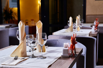 Cafe or restaurant interior and table settings