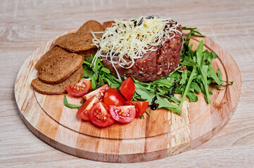 Beef cutlet with salad, cheese and bread