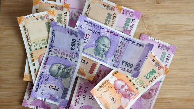 Counting Indian currency Rupee , hand giving Indian money 100, 200, 2000 rupees banknote Kerala India 4K slow motion video, footage. Business woman counting giving money cash new Indian currency notes