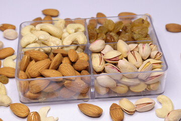 Silver Tray with mixed dried fruits on white Background