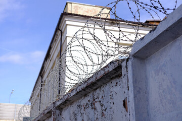 Fence covered with barbed wire