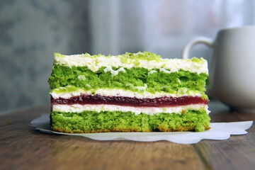 the structure of the sponge cake in the section green and multicolored layers