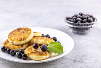 homemade cheesecakes with black currant berries