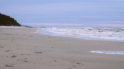 Fototapeta na wymiar Seaside Beach Landscape with High Waves on Windy Day 