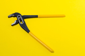Plumbing adhesives on yellow background